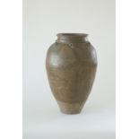A large South East Asian glazed stoneware storage jar, 15th/16th Century,