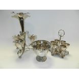 Two trays of electroplated tea wares and brass ware to include candlesticks, egg cruet, epergne,