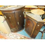 A George III and later oak bowfront wall hanging corner cabinet along with a 19th century oak