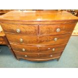 A 19th century mahogany bowfront chest of two short over three long drawers fitted with brass ring