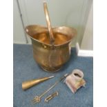 A large brass bucket, together with a brass horn,