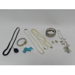 Two cultured pearl necklaces together with a silver bangle a French jet bead necklace, a wristwatch,