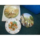 A box of various collectors plates