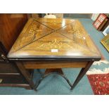 A late Victorian/Edwardian rosewood veneered and marquetry envelope type card table