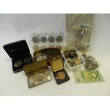 A collection of various cased and loose coinage and banknotes,