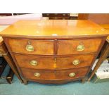A 19th century bowfront mahogany chest of two short over two long drawers fitted with brass swing