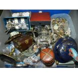 A box containing a miscellaneous assortment including a pair of brass candlesticks,