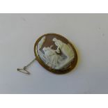 An oval shell cameo brooch within yellow metal mount stamped 9ct