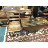 A child's elm bar back kitchen chair along with a primitive oak drop-leaf occasional table along