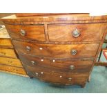 A 19th century mahogany bowfront chest of two short over three long drawers fitted with brass ring