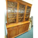 A modern yew wood veneered bookcase cabinet