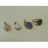 An opal doublet dress ring together with an oval cabochon opal pendant,