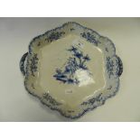 A Dutch Delft crimped hexagonal two handled tray decorated with a blue and white tray decorated