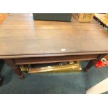 A late 19th century dark stained farmhouse table