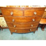 A 19th century mahogany bowfront chest of two short over three long drawers fitted with pressed