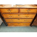 A George III oak crossbanded mahogany chest of two short over three long drawers (lacking feet)