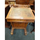 A Victorian figured and burr veneered davenport desk with slender tapering fluted front pilasters