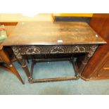 A 17th century and later oak single drawer side table