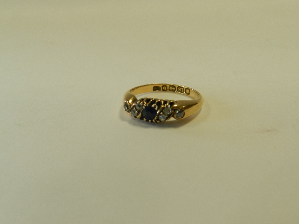 An 18ct gold sapphire and diamond ring