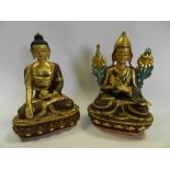Two modern cast ornamental figures of The Buddha with coloured facial details and ornament
