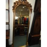 A reproduction gilt framed dressing mirror with foliate bracket surmount,