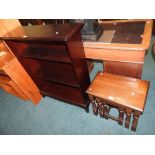 A mahogany finished free standing bookcase with adjustable shelves,