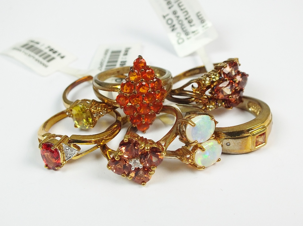 A collection of seven 9ct gold stone set rings to include a sapphire and diamond example,