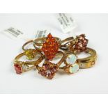 A collection of seven 9ct gold stone set rings to include a sapphire and diamond example,