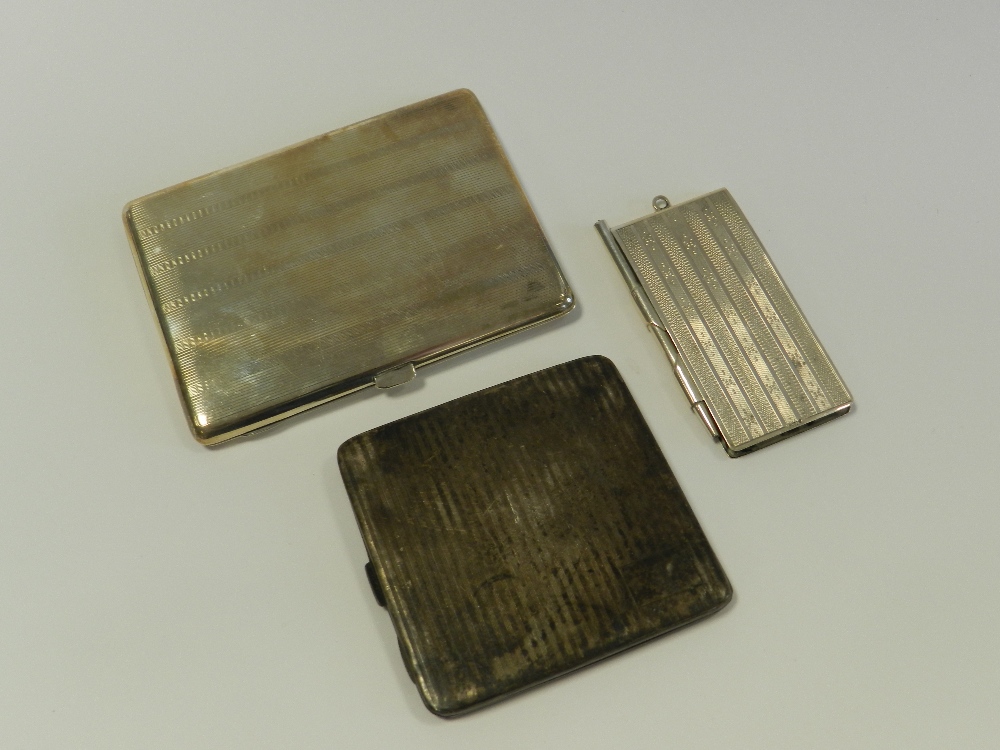 A silver cigarette case together with a sterling silver cigarette case and a white metal mounted