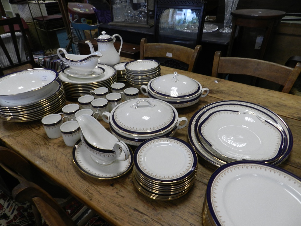 An Aynsley Leighton pattern blue banded and gilt decorated dinner service along with coffee pot and