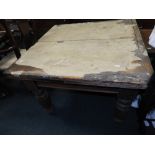 A late Victorian pull-out dining table along with a mid 20th century oak veneered occasional table