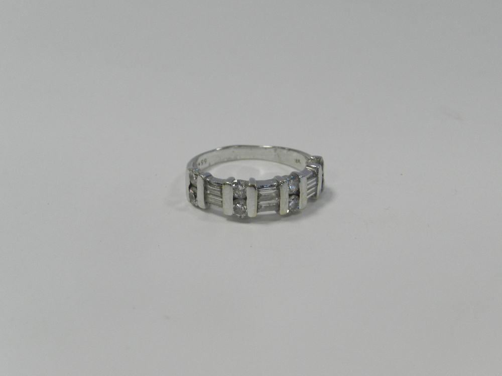 A diamond set half hoop eternity ring,