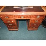 A late Victorian mahogany pedestal desk with three frieze drawers and six pedestal drawers,