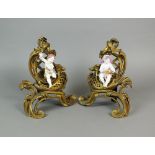 A pair of French gilt bronze and porcelain mounted chenets, 19th century in Rococo style,