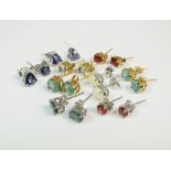 A pair of 9ct yellow gold aquamarine set earrings, a pair of 9ct white gold opal set earrings,