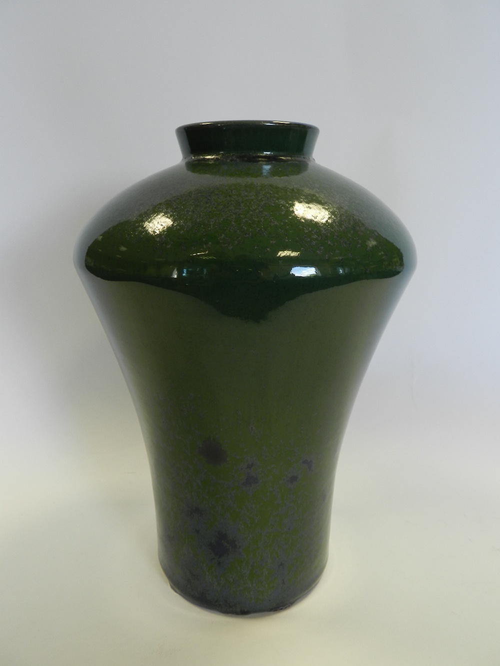 A high fired green and mottled blue high shouldered stone ware Art Pottery vase