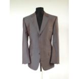 A Gucci suit, mauve, single vent, contrast burgundy lining, Italian size 50R, 54% wool, 46% silk,
