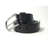A Prada black leather belt with square end and a silver buckle, size 36