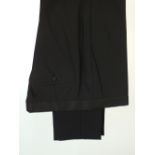 A pair of Gucci evening trousers, black, grosgrain detailing to waistband, pocket, button, flat