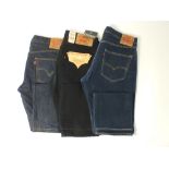 Three pairs of Levi 501 jeans, two blue, one black, one blue 36/36, the other 36/34, the black 36/