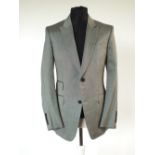 A Gucci suit, grey single vent, Gucci logo lining in dark grey lining, Italian size 52R, 64 wool,