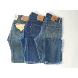 Three pairs of Levi 501 jeans, blue, one with tags, 34/34