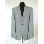 A Gucci jacket, blue and black dog tooth check, Gucci logo to blue/black lining, single vent,