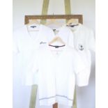 Four Gucci t-shirts, three v-neck, one round neck, two cream and two white, with various logos and