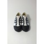 A pair of Y3 Yohji Yamamoto for Adidas trainers, white leather with black detailing and Y3 orange