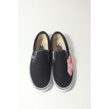 A pair of Vans, classic slip-on, black canvas with white rubber, UK size 9
