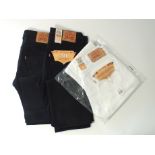 Three Levi 501 jeans, two black, one white, 34/34, two with tags