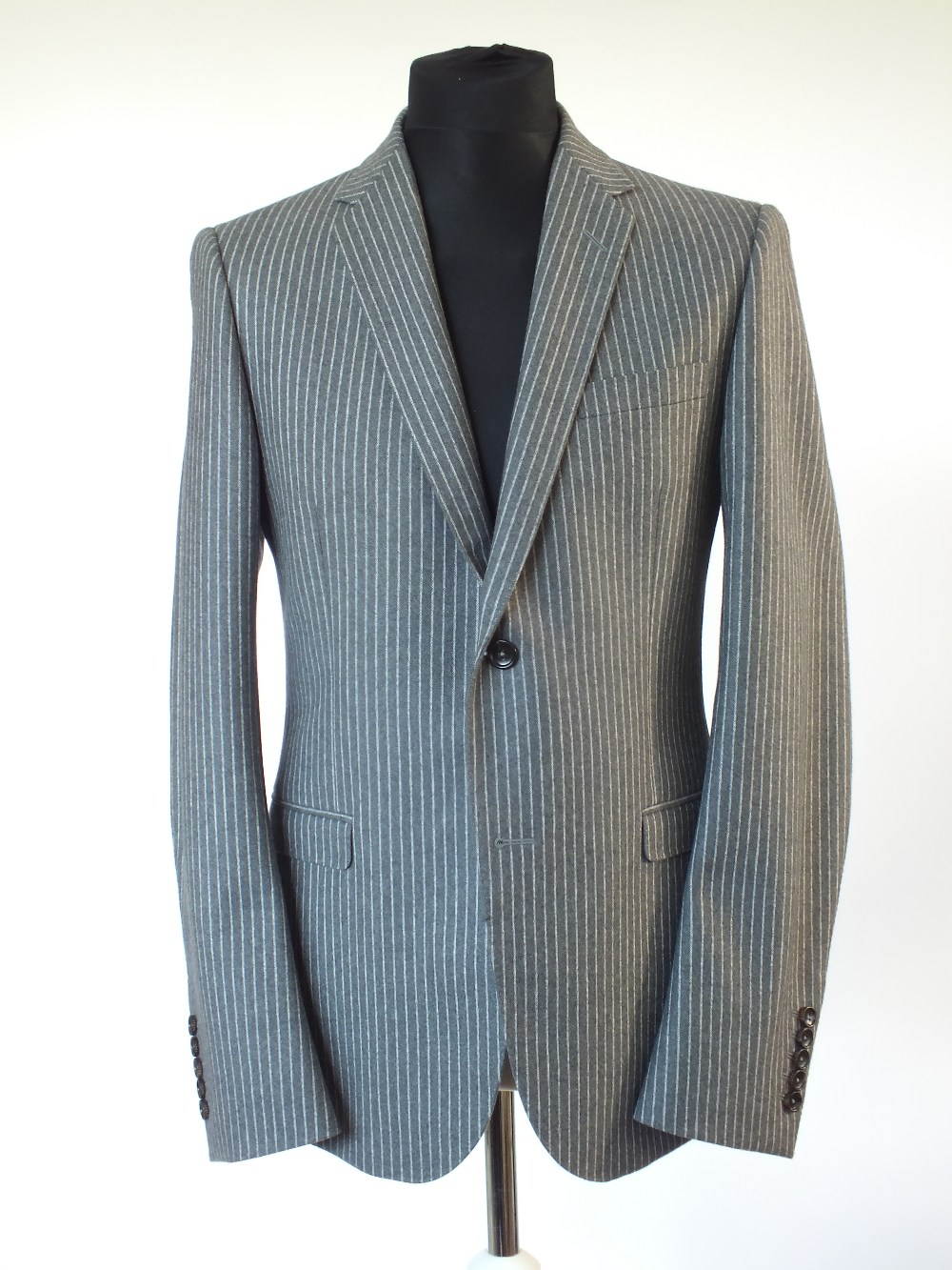 A Gucci three piece suit, grey pinstripe, double vent, Italian size 52R, 100% wool, flat front to