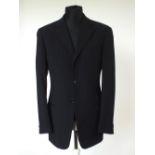 An Armani suit, navy pinstripe, lined jacket, pleat front trousers, Italian size 50R, 98% wool, 2%