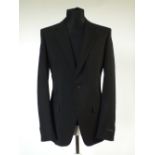A Prada suit, black, swing ticket attached, single vent, Italian size 52R, 60% mohair, 40% wool,
